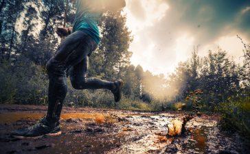 Running over muddy ground on a cross-country run.