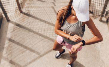 Checking her split times and her pacing.