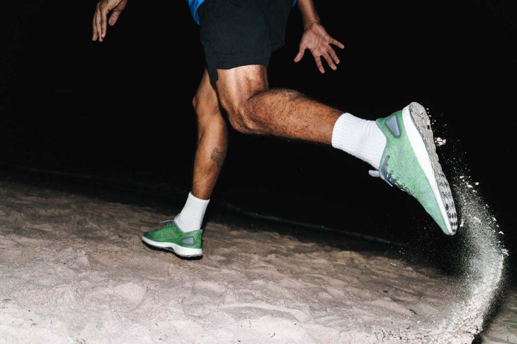night time running in the sand